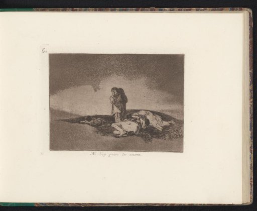 Mourning man beside dead bodies