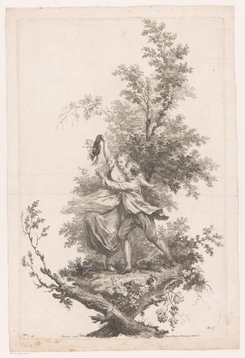 Man and woman embracing with a hat full of grapes