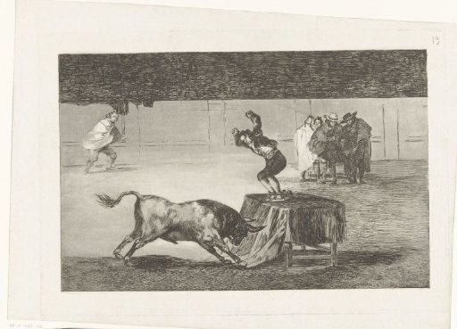Bullfighter standing on a table in an arena