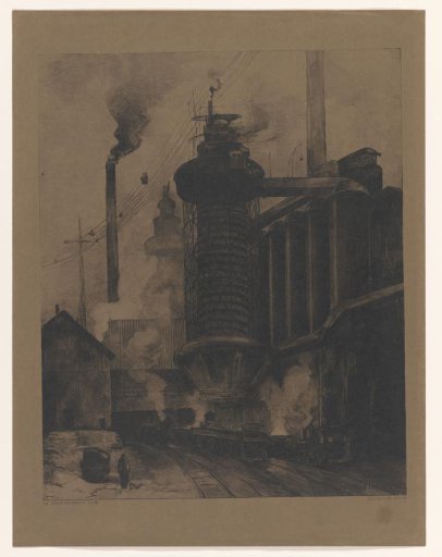 Railway Line with Train Along a Large Factory Building