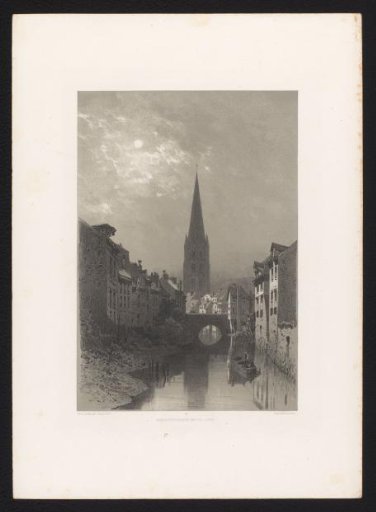 Houses and church tower in moonlight
