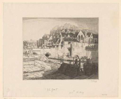 Quay and river along a town on a hill