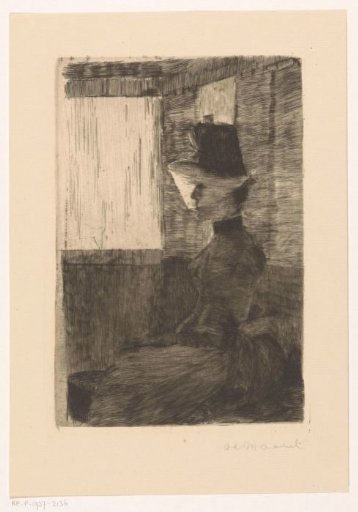 Veiled woman in a train compartment