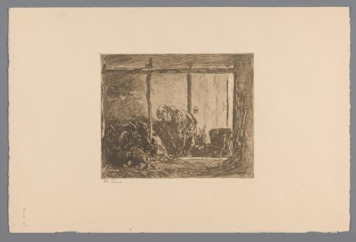 Farmer and cow in a stable