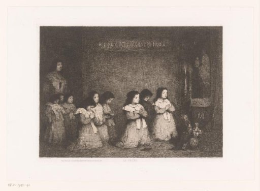 Group of girls praying before a statue of Mary
