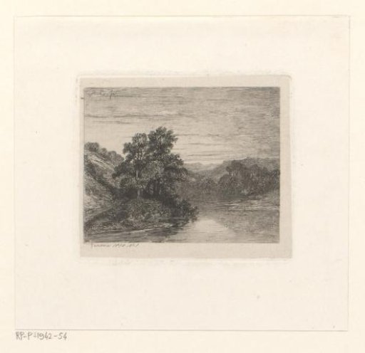 Mountain landscape with deciduous trees by a lake
