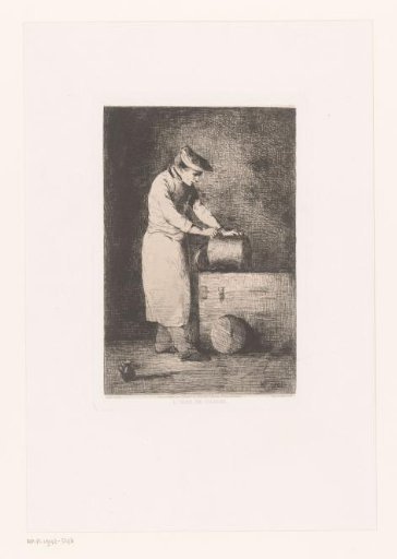 Dark interior with a man cleaning a pan