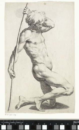Kneeling man with a staff