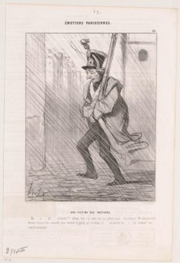 Soldier of the National Guard patrols through the rain