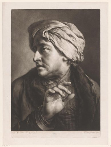 Older man with a headscarf and his hand raised