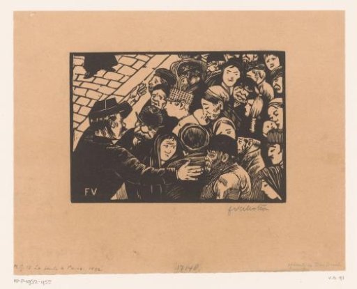 Policeman holding back a crowd