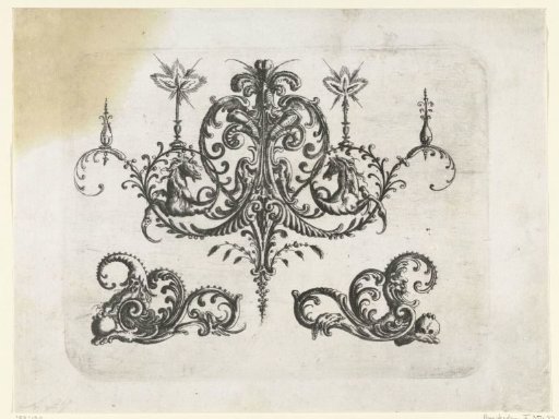 Two burning candles on volutes of leafy tendrils