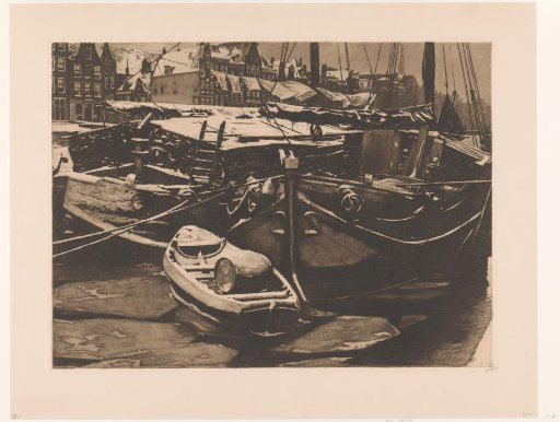 View of moored ships in the Oudeschans in Amsterdam