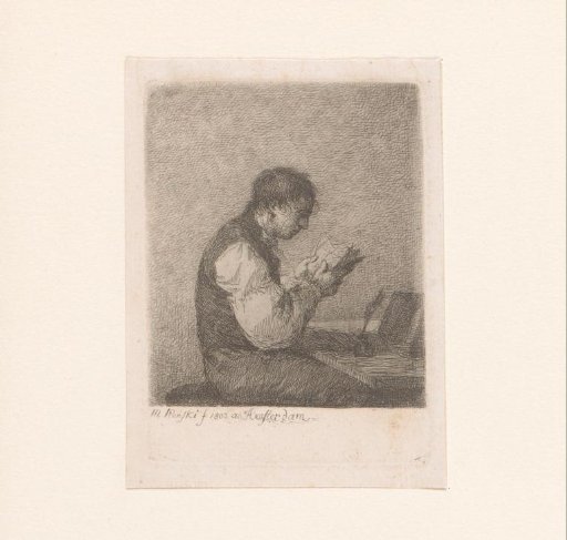 Man reading at a desk