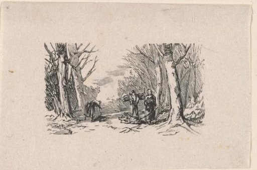 Man and two women gathering firewood in the forest