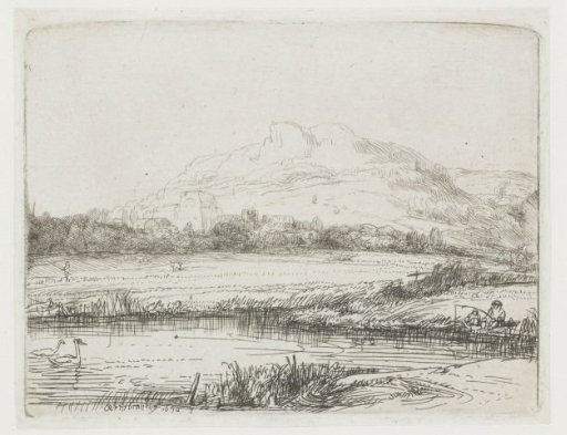Canal with an angler and two swans