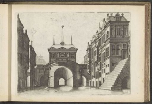 View of a canal with a bridge and a staircase on the left
