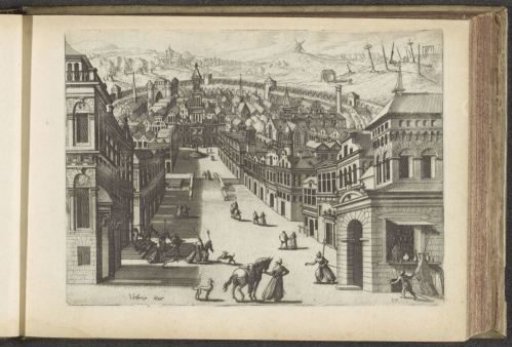 View of a descending street and a walled city
