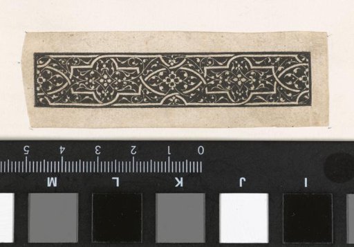 Frieze with white moors and arabesques on a black ground