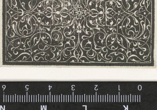 Arabesques with a four-petaled flower in the center