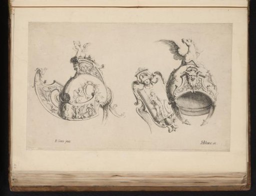 Two helmets and a shield with ornaments
