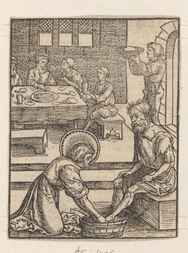 Man washing the feet of a poor man