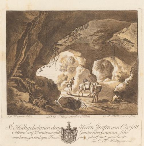 Traveler with two donkeys in a cave