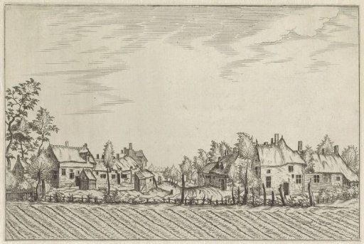 Farmhouses near a ploughed field