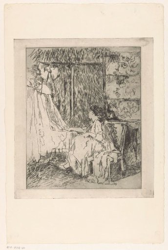 Woman sitting on a chair next to a cradle