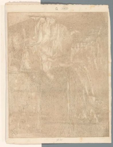 Woman sitting on a chair next to a cradle