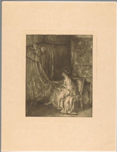 Woman sitting on a chair next to a cradle