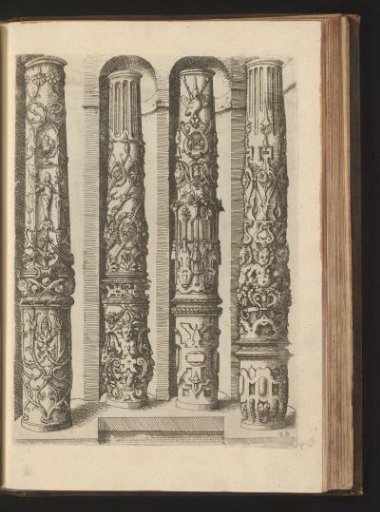 Four shafts of Composite columns decorated with scrollwork, grotesques, laurel wreaths, and garlands