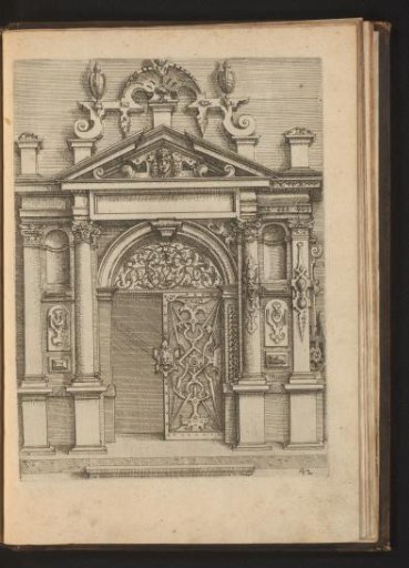 Portal with iron railing and decorated with mascarons and scrollwork