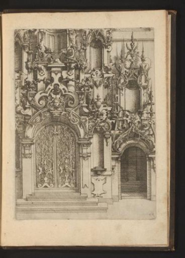 Portal decorated with leafy vines, mascarons and scrollwork