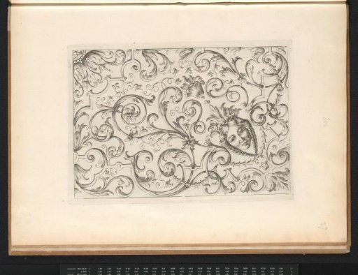 Marquetry with a mask and acanthus scrolls