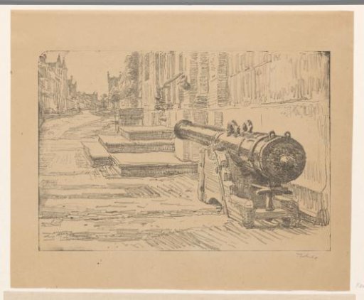 Street in Enkhuizen with an old cannon