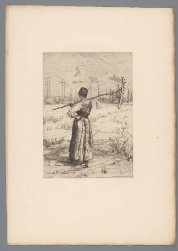 Woman with a rake in a field