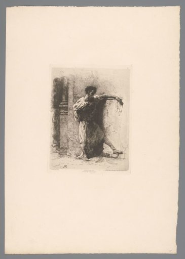Standing man by a wall