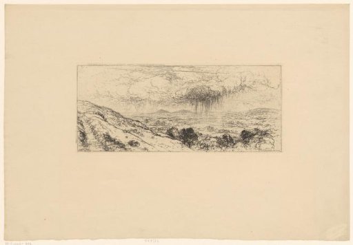 Rain showers over a hilly landscape