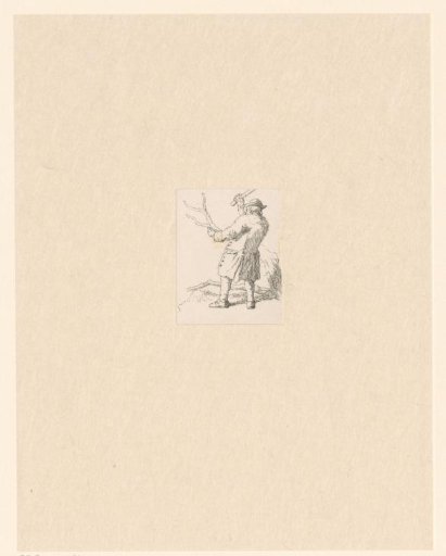 Standing man chopping tree branches