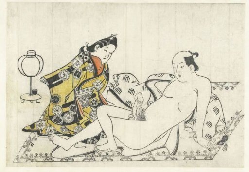 Young woman and naked man on a carpet
