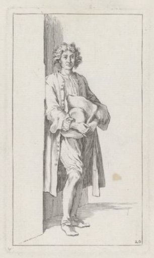 Young man with a hat in his hand