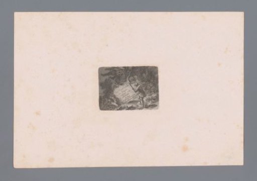 Man illuminating text on a stone with a torch