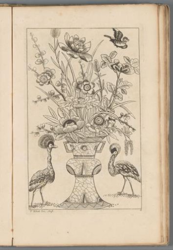 Flower vase flanked by birds