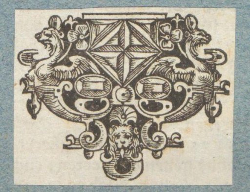 Ornament with gemstones and a mask