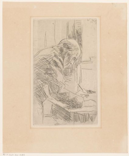 Man writing at a desk