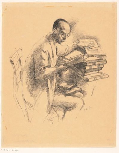 Man behind a desk full of books