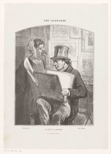 Man and woman viewing prints in an art shop
