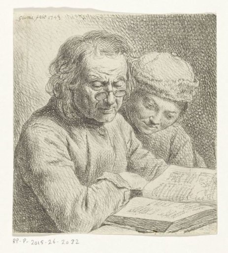 Man and boy reading a book