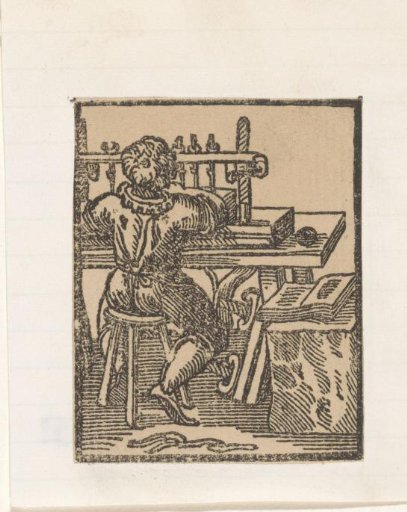 Bookbinder at his workbench